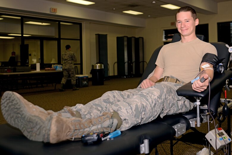 U.S. Air Force Senior Airman Mike Strickland, 20th Security Forces Squadron installation patrolman, sits on a donor bed while making his annual blood donation at a blood drive at Shaw Air Force Base, S.C., Jan. 20, 2017. Approximately 38 percent of the United States population is eligible to donate, but less than 10 percent give per year. (U.S. Air Force photo by Airman 1st Class Kathryn R.C. Reaves)