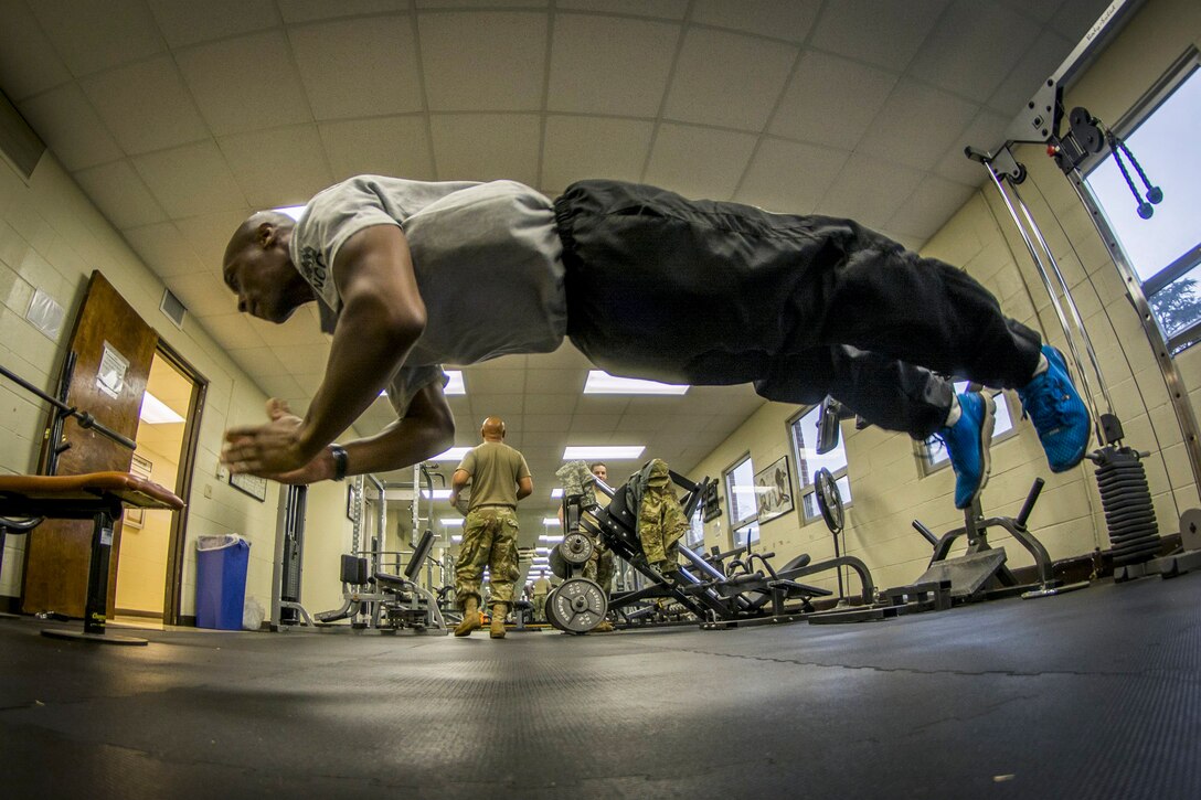 Army Reserve Sgt. Wenceslaus Wallace does pushups in the headquarters building of the 335th Signal Command (Theater) in East Point, Ga., Jan. 21, 2017. Wallace is a team leader assigned to Company C, 324th Expeditionary Signal Battalion. Army photo by Staff Sgt. Ken Scar