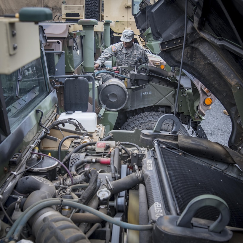 U.S. Army Reserve Sgt. Sedric Smith, a human resources specialist with the 335th Signal Command (Theater) from Tutwiler, Miss. checks the oil on a Humvee as part of preventative maintenance checks and services in the command’s motor pool in East Point, Ga., Jan. 22, 2017. 