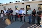 Army Col. Robert J. Miceli, Defense Contract Management Agency Phoenix commander; and Keith L. Duncan, DCMA Albuquerque - El Paso quality assurance team leader, cut the ribbon for the agency’s new Fort Bliss office facility. Members of the DCMA El Paso team assisted in the ceremony and celebrated the grand opening of the new office space. From left, Kim Birch, Homero U. Ramos, Eduardo Luera, Jesus Barrios, José G. Arrieta, Miceli, Duncan, Army Lt. Col.  John S. Pires, James D. Avant, Maria Ludwig and Alex Luna. (DCMA photo by Jay Maitland, DCMA Albuquerque - El Paso) 