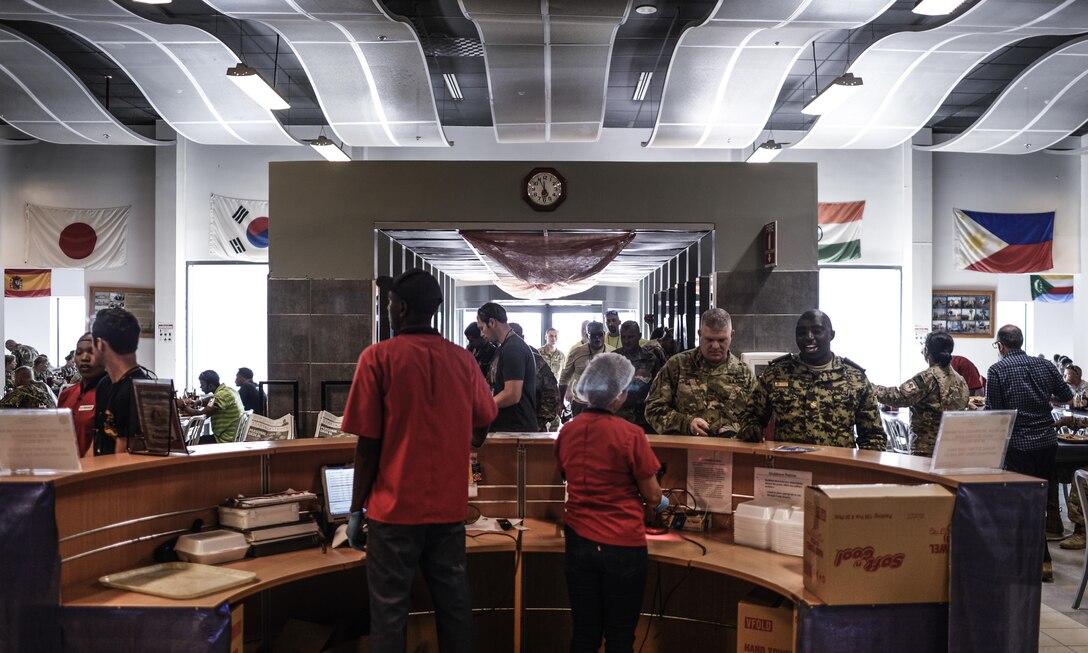 Brig. Gen. Kenneth H. Moore, U.S. Army Africa deputy commander checks into the galley to dine with Army Reserve members during his visit to Camp Lemonnier, Djibouti, Jan. 16, 2017. Brig. Gen. Moore met with Army Reserve Soldiers to discuss the Army’s overall mission objective on the continent of Africa.