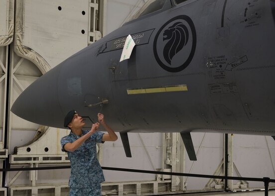 A Republic of Singapore Air Force airman reveals the name of RSAF Lt. Col. Oon Kok Choon, the incoming senior-ranking officer and Peace Carvin V Detachment Commander, on an F-15SG during a change of assignment ceremony at Mountain Home Air Force Base, Idaho, Jan. 17, 2017. Oon was the head of Flying Training Branch -Air Training Department before his arrival. (U.S. Air Force photo by Airman 1st Class Chester Mientkiewicz/Released)