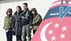 Republic of Singapore Air Force Senior Lieutenant Colonel Tham Yeow Min, 428th Fighter Squadron senior-ranking officer, poses with his family on the 428th flagship, Jan. 17, 2017, at Mountain Home Air Force Base, Idaho. Tham handed command over to Lieutenant Colonel Oon Kok Choon at the Peace Carvin V change of assignment and appointment parade. (U.S. Air Force photo by Senior Airman Malissa Lott/Released)