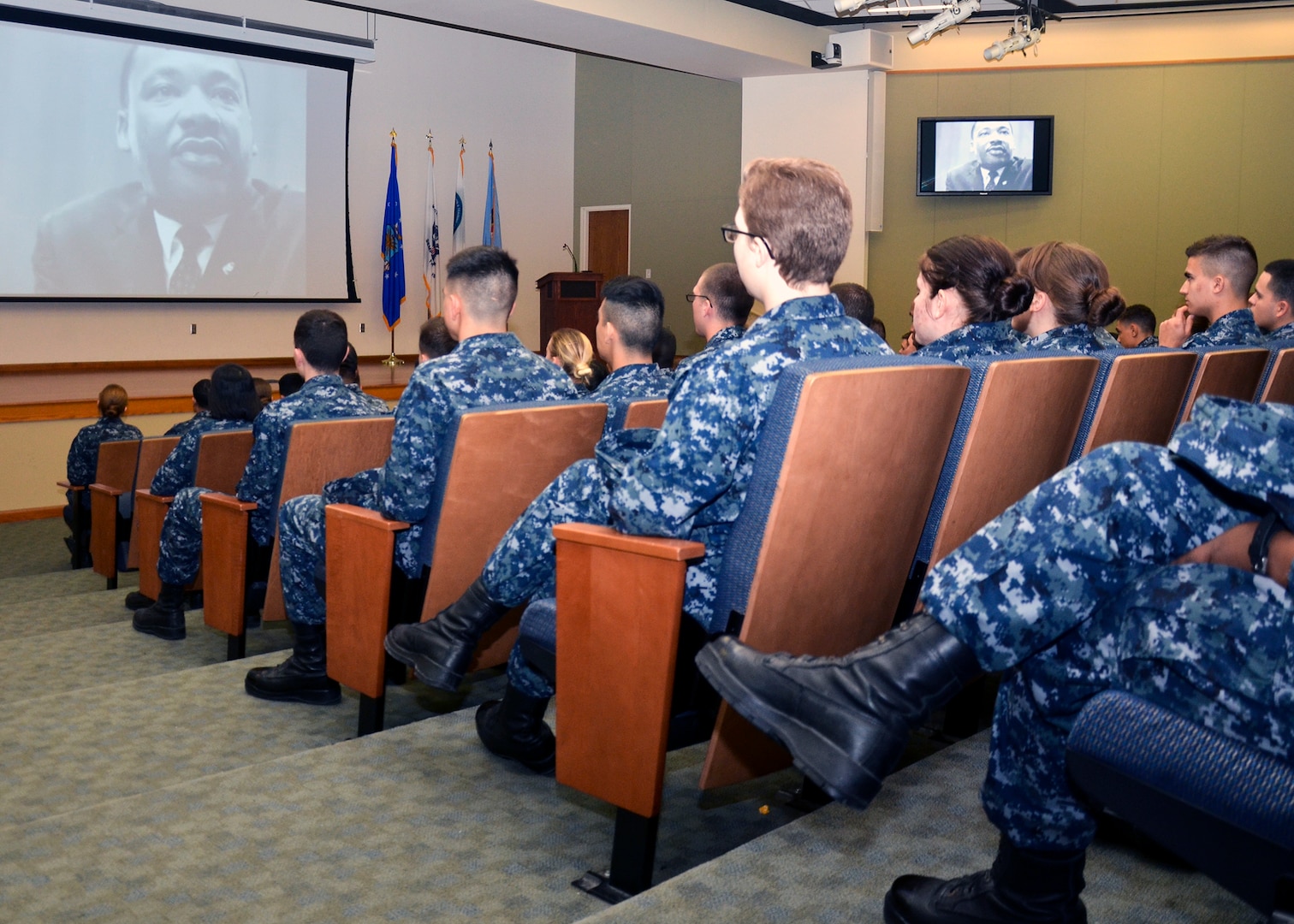 Staff and students from Navy Medicine Training Support Center watch a video during a celebration to honor Dr. Martin Luther King Jr. at the Medical Education Training Campus at Joint Base San Antonio-Fort Sam Houston Jan. 17. NMTSC's Diversity Council planned and conducted a ceremony and reception to honor King and educate personnel about what he accomplished. 
