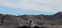 An F-22 Raptor assigned to the 1st Fighter Wing, Joint Base Langley-Eustis, Va., taxis on the flightline of Nellis Air Force Base, Nev., before participating in Red Flag 17-1, Jan. 18, 2017. Red Flag provides combat training in a degraded and operationally limited environment making the training missions as realistic as possible. (U.S. Air Force photo by Airman 1st Class Kevin Tanenbaum/Released