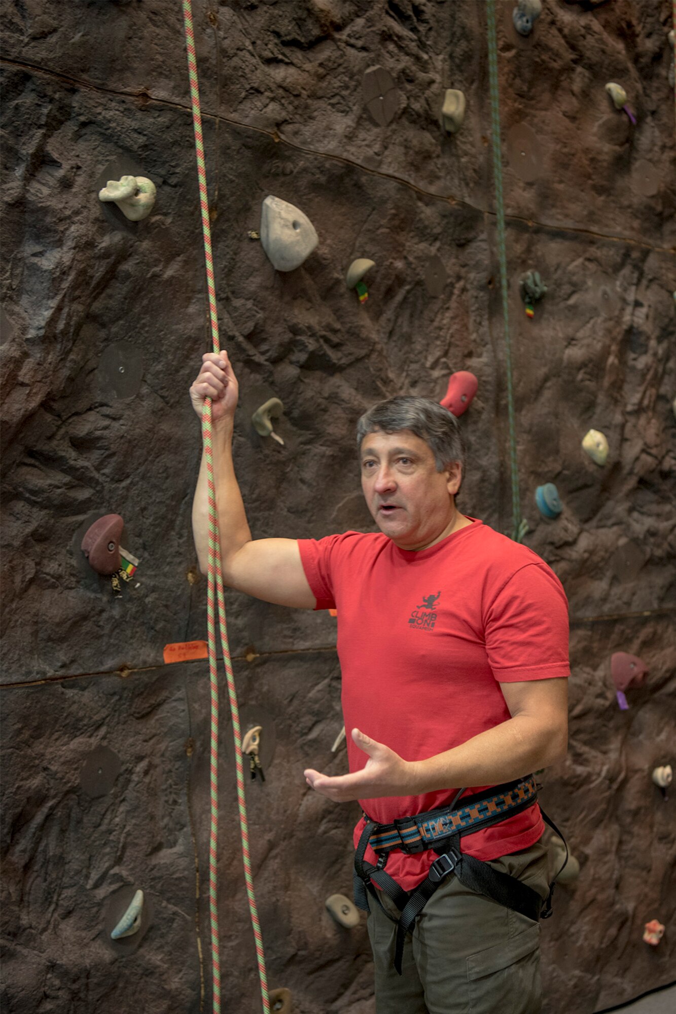 PETERSON AIR FORCE BASE, Colo. – Dan Rodriguez, 21st Civil Engineer Squadron deputy base civil engineer, goes over the basics of how to safely climb the rock wall at the Peterson Air Force Base Fitness Center, Dec. 14, 2016. Rodriguez has been instructing the classes at the fitness center for over 10 years. (U.S. Air Force photo by Steve Kotecki)