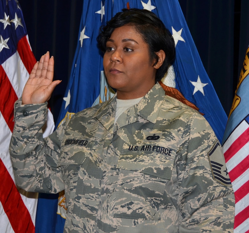 Air Force Master Sgt. Nikki Broomfield raises her right hand and agrees to abide by the Air Force Senior Non-commissioned officer charge during a ceremony in honor of her promotion Jan. 19, 2017 on Defense Supply Center Richmond, Virginia. 