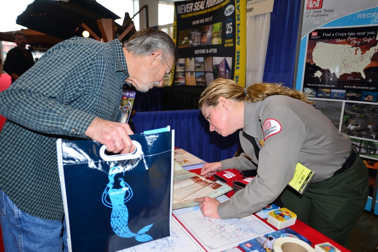Amber Jones, park ranger at the U.S. Army Corps of Engineers Nashville District’s J. Percy Priest Lake in Nashville, Tenn., talks with Karlos Thomas from Mt. Juliet, Tenn., during the 31st annual Progressive Nashville Boat & Sportshow at the Nashville Music City Center Jan. 20, 2017.  
