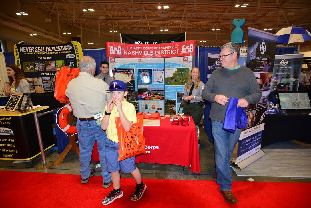 Lindsey Sullivan and Kyle Beverly, both park ranger at the U.S. Army Corps of Engineers Nashville District’s J. Percy Priest Lake in Nashville, Tenn., talk with boating enthusiasts during the 31st annual Progressive Nashville Boat & Sportshow at the Nashville Music City Center Jan. 22, 2017.  