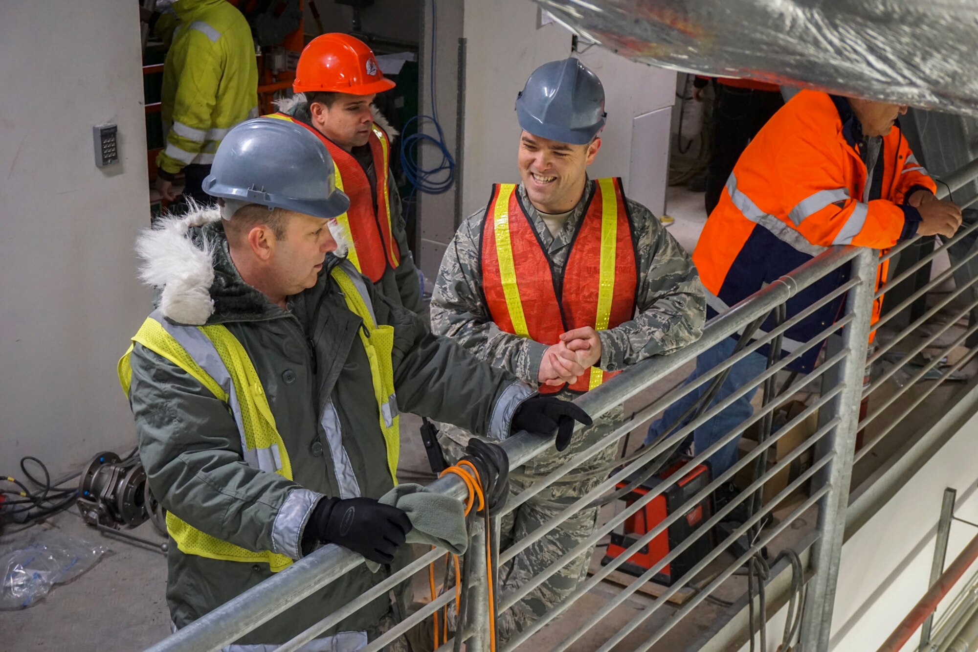 THULE AIR BASE, Greenland – Col. Doug Schiess, 21st Space Wing commander, learns about the 821st Air Base Group mission from Airmen during his visit to Thule Air Base, Greenland, Jan. 12, 2017. Schiess experienced how the Greenlandic, Danish and Canadian partners work closely with Airmen to accomplish the mission. (Courtesy photo) 