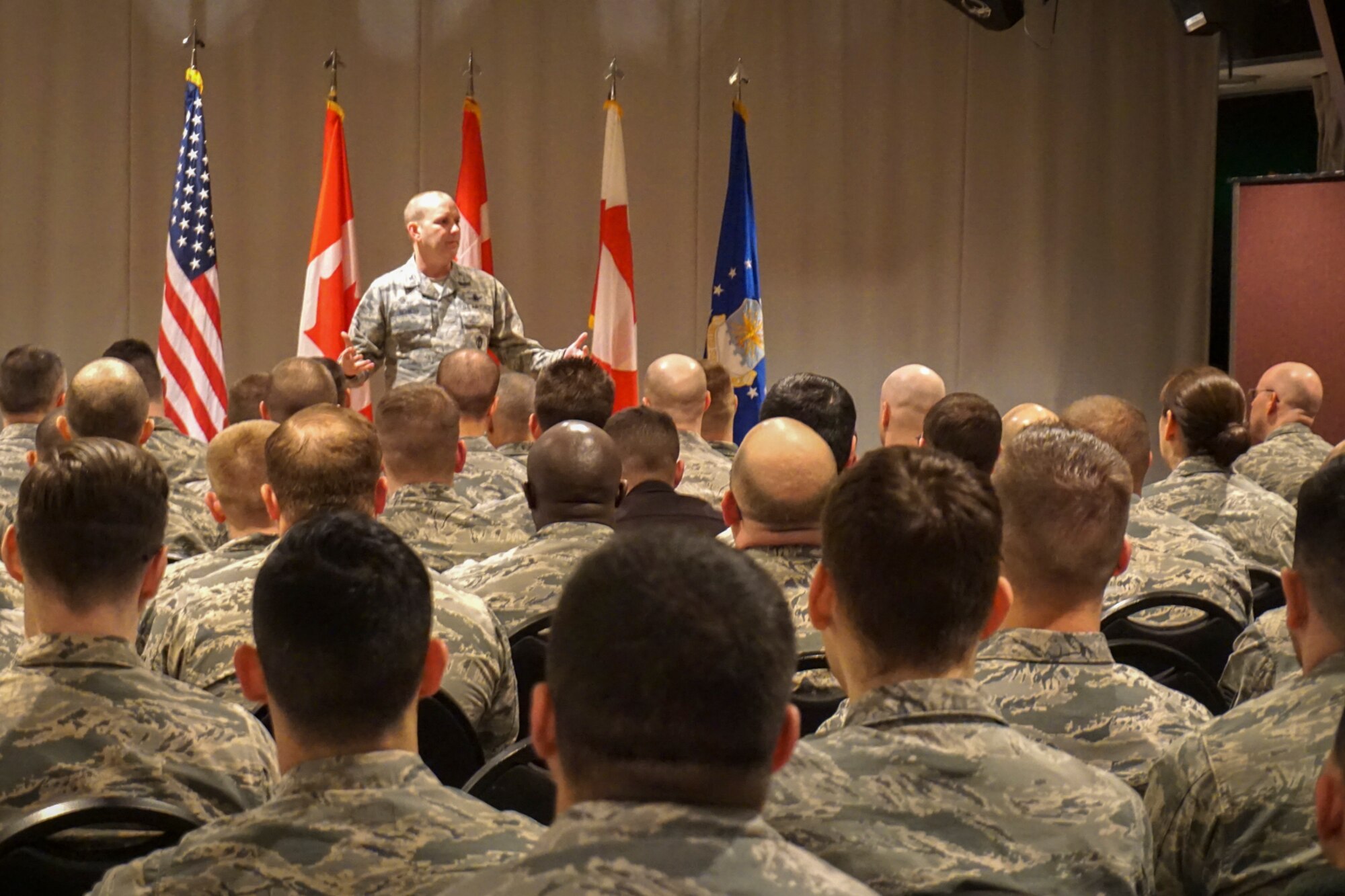 THULE AIR BASE, Greenland – Col. Doug Schiess, 21st Space Wing commander, speaks to Thule Airmen during an All Call at Thule Air Base, Greenland, Jan. 12, 2017. During his visit, Schiess toured the 821st Air Base Group and the 12th Space Warning Squadron to see them provide unrivaled space superiority under extreme conditions. (Courtesy photo)