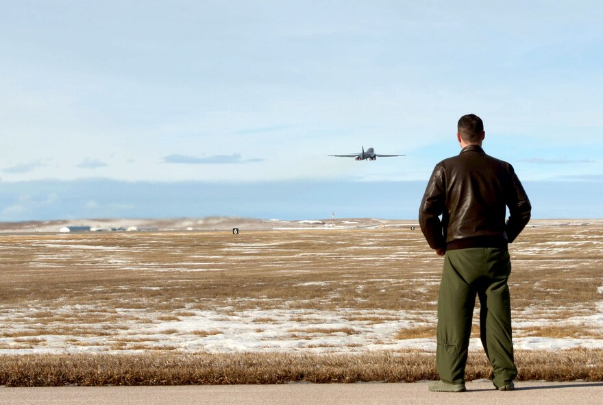 Maj. Jonathan Vogel, the 28th Bomb Wing commander’s executive officer, watches as a B-1 bomber takes to the sky at Ellsworth Air Force Base, S.D., Jan. 20, 2017. Five B-1’s flew to Nellis Air Force Base, Nev., to participate in Red Flag – a joint exercise training aircrew and pilots from across the world in air-to-air combat. (U.S. Air Force photo by Airman 1st Class Donald C. Knechtel)