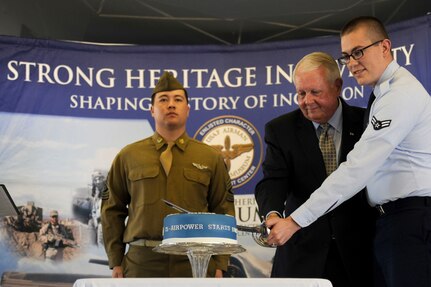 Ret. Gen Hal Hornburg, 27th Commander of Air Education and Training Command, cuts a cake with Airman 1st Class Matthew Turner, AETC commander support staff, at the AETC 75th Extravaganza Event at JBSA-Randolph, Texas Jan. 23, 2017. The cake-cutting ceremony officially ended the festivities. The event was held to mark the command's 75-year history of training Airmen to fly, fight and win our nation's wars. (U.S. Air Force photo by Tech. Sgt. Ave I. Young)