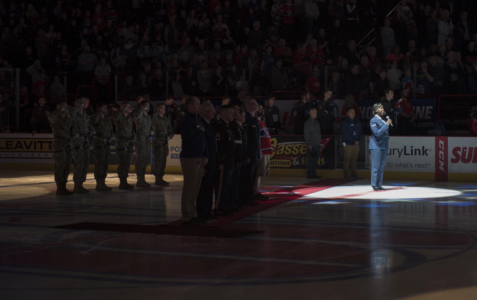 Airman 1st Class Mary Dunkley, 92nd Maintenance Squadron training manager, sings the national anthem during the Spokane Chiefs Military Appreciation Night Jan. 21, 2016, Spokane, Wash. The night featured military-themed jerseys, military personnel highlights and military-themed towel giveaways. (U.S. Air Force photo/Airman 1st Class Sean Campbell)