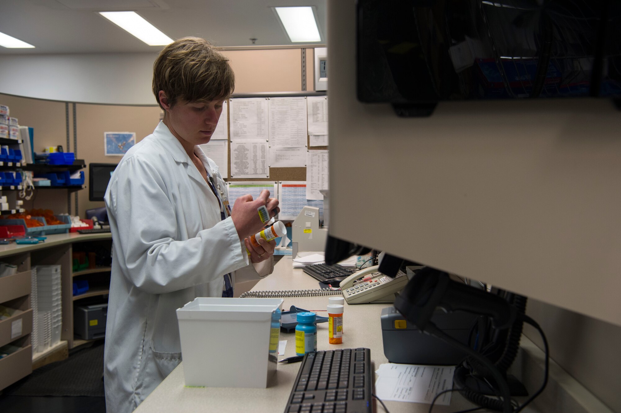 Natasha Kalda, 90th Medical Support Squadron pharmacist, fulfills prescriptions at F.E. Warren Air Force Base, Wyo., Jan. 20, 2017. The Air Force celebrates Biomedical Science Corps Appreciation Week Jan. 23 to 27. The Biomedical Science Corps is comprised of 15 medical AFSCs of which 10 are represented at F.E. Warren. (U.S. Air Force photo by Staff Sgt. Christopher Ruano)
