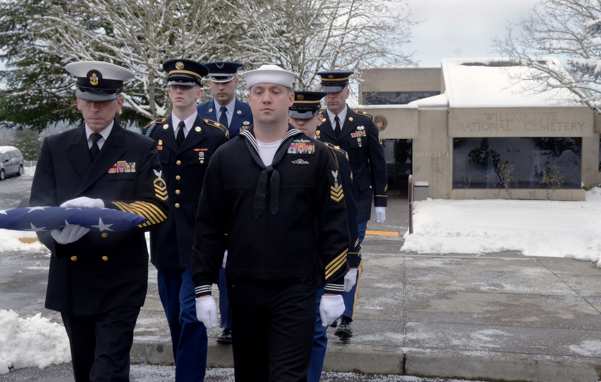 Members of the U.S. Navy Reserve along with members of the Oregon National Guard Army and Air National Guard form a 6-man team as they perform military funeral honors at Willamette National Cemetery, Portland, Ore., Jan. 13, 2017. (U.S. Air National Guard photo by Tech. Sgt. John Hughel, 142nd Fighter Wing Public Affairs) 