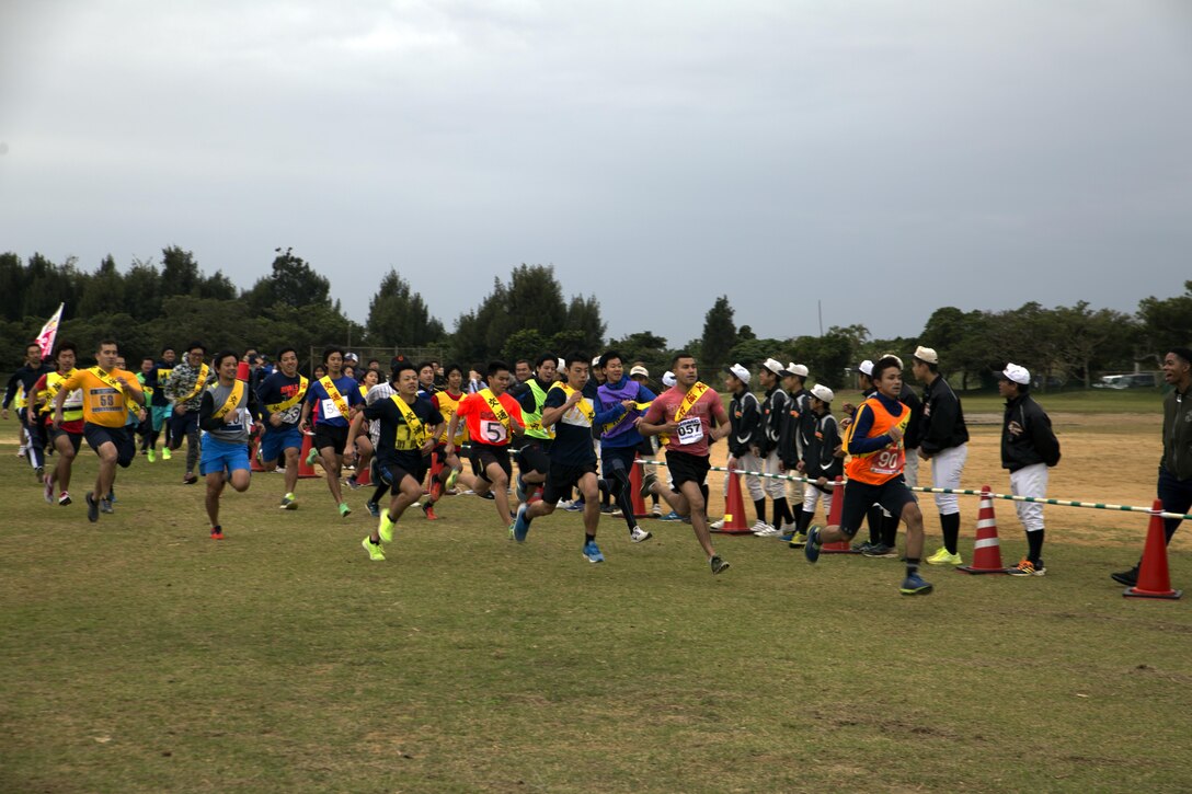 MARINE CORPS AIR STATION FUTENMA, OKINAWA, Japan – Runners take off Jan. 21 at the start of the Ginowan City Traffic Safety Relay Race at Marine Corps Air Station Futenma. Participants of the 14-kilometer race obeyed all crosswalk and traffic signals in an effort to raise awareness about traffic safety. Events like this get Marines out in to the community and strengthen the U.S-Japan alliance.