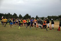 MARINE CORPS AIR STATION FUTENMA, OKINAWA, Japan – Runners take off Jan. 21 at the start of the Ginowan City Traffic Safety Relay Race at Marine Corps Air Station Futenma. Participants of the 14-kilometer race obeyed all crosswalk and traffic signals in an effort to raise awareness about traffic safety. Events like this get Marines out in to the community and strengthen the U.S-Japan alliance.