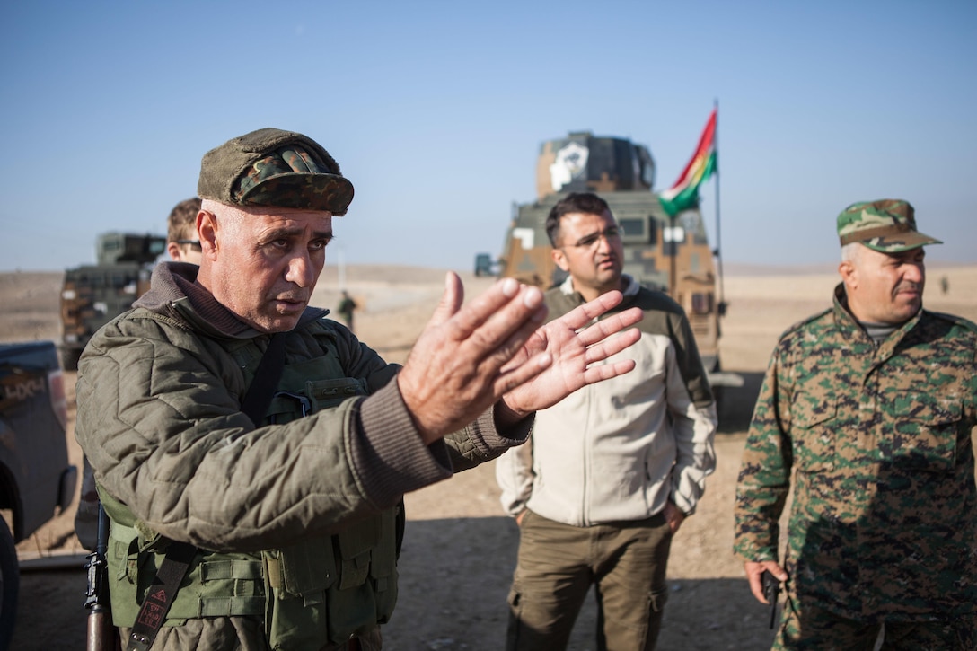 Peshmerga soldier discusses day’s mobile checkpoint training with fellow soldiers at Black Tigers Training Camp, Iraq, January 19, 2017, as part of Combined Joint Task Force–Operation Inherent Resolve (U.S. Army/Josephine Carlson)