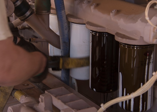 Staff Sgt. Abraham Wanner, a 370th Air Expeditionary Advisory Group Detachment 1 power production craftsman, removes oil filters from a generator at Al Asad Air Base, Iraq Jan. 8, 2017. The power production team’s primary mission at Al Asad is to provide power to the 66th Rescue Squadron, which manages combat search and rescue forces in support of Operation Freedom’s Sentinel.  (U.S. Air Force photo/Senior Airman Andrew Park)