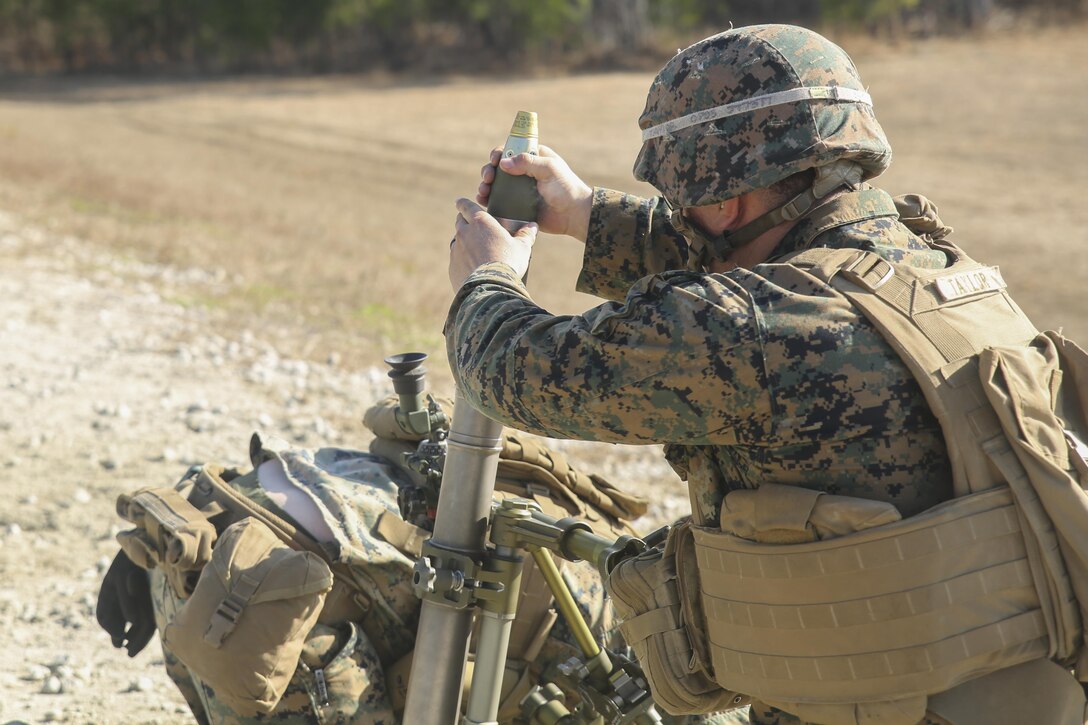 A Marine with Task Force Southwest inserts a round into an M224 60mm mortar during a live-fire training event at Camp Lejeune, N.C., Jan. 18, 2016. Approximately 30 Marines with the unit practiced firing, cleaning and practicing immediate action techniques on the weapon as part of their preparation for an upcoming deployment to Helmand Province, Afghanistan. Task Force Southwest is comprised of about 300 Marines, whose role will be to train, advise and assist the Afghan National Army 215th Corps and the 505th Zone National Police as part of NATO’s Resolute Support mission. (U.S. Marine Corps photo by Sgt. Lucas Hopkins)
