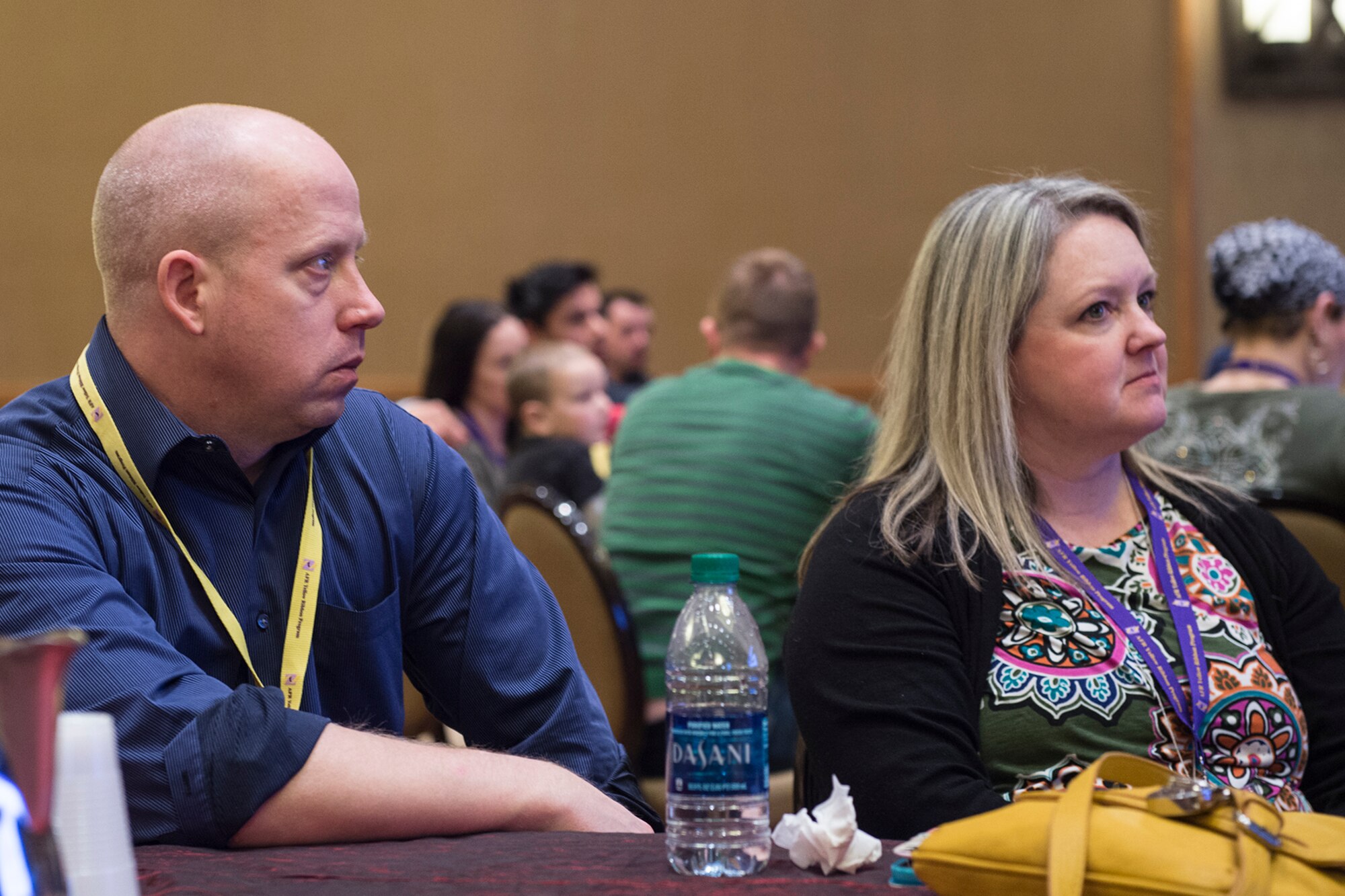 Senior Master Sgt. Mike Bier, 934th Security Forces Squadron superintendent, stationed at Minneapolis-St. Paul Air Reserve Station, Minnesota, and his guest Stephanie Woodward, participate in a breakout session at a Yellow Ribbon Reintegration Program event in Denver, Jan 22, 2016. The Yellow Ribbon Reintegration Program promotes the well-being of reservists and their families by connecting them with resources before and after deployments. (U.S. Air Force photo/Tech. Sgt. Benjamin Mota)
