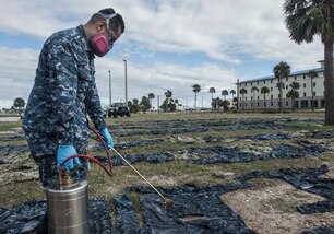 170123-WZ792-022 (Jan. 23, 2017) MAYPORT, Fla. - Hospital Corpsman 3rd Class Joshua Nieto of Navy Entomology Center of Excellence (NECE) Jacksonville, Fla.,  applies the insect repellant Permethrin to uniforms at Naval Station Mayport, Fla. Treating uniforms is one of many preparations  service members are taking before departing on Continuing Promise 2017 (CP-17). Continuing Promise 2017 is a U.S. Southern Command-sponsored and U.S. Naval Forces Southern Command/U.S. 4th Fleet-conducted deployment to conduct civil-military operations including humanitarian assistance, training engagements, and medical, dental, and veterinary support in an effort to show U.S. support and commitment to Central and South America. (U.S. Navy Combat Camera photo by Mass Communication Specialist 2nd Class Ridge Leoni)