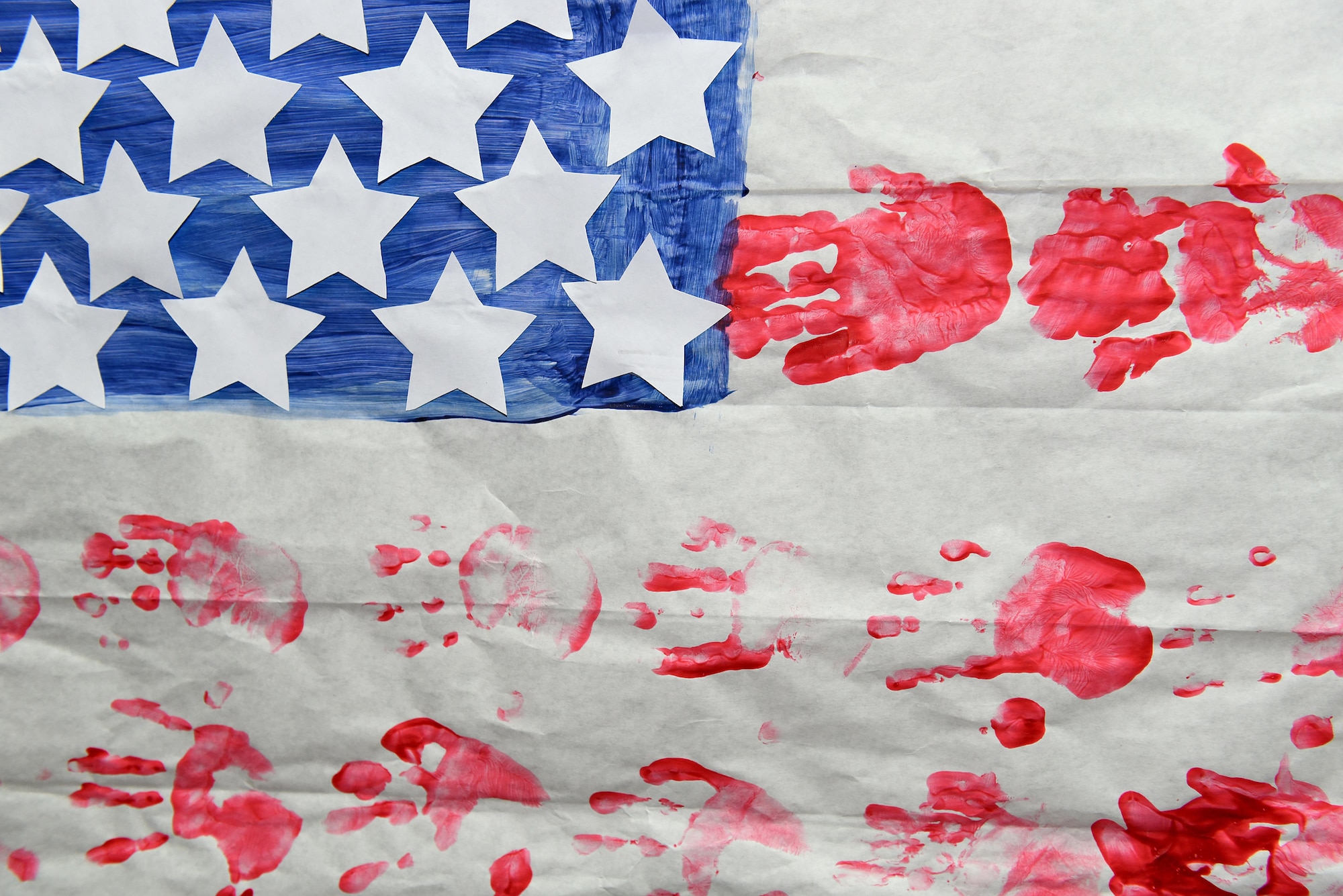 An American flag created from hand prints by elementary school childern in east Tennessee for appreciation to a service member hangs on a wall at the I.G. Brown Training and Education Center in Louisville, Tenn. (U.S. Air National Guard photo by Master Sgt. Mike R. Smith)