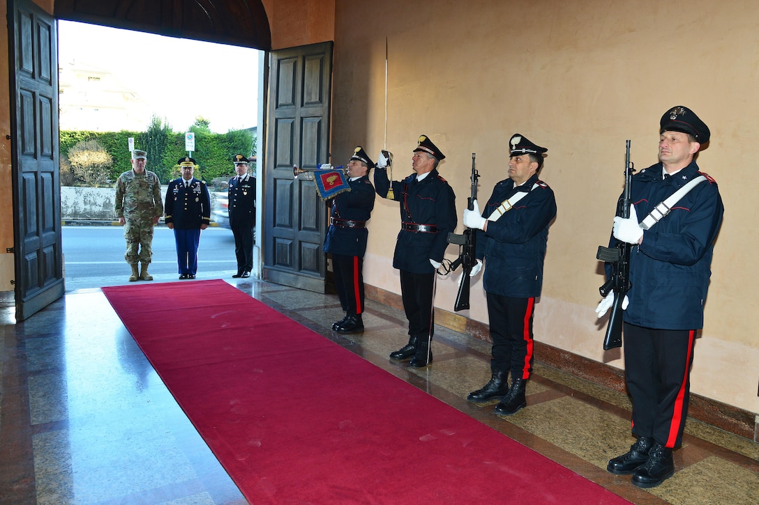 Lt. Gen. Charles D. Luckey (left), Commanding General U.S. Army Reserve Command, U.S. Army Col. Darius S. Gallegos (center), CoESPU deputy director and and Col. Roberto Campana (right), chief of staff CoESPU, render salutes during the playing anthems during visit at Center of Excellence for Stability Police Units (CoESPU) Vicenza, Italy, January 20, 2017.(U.S. Army Photo by Visual Information Specialist Paolo Bovo/released)