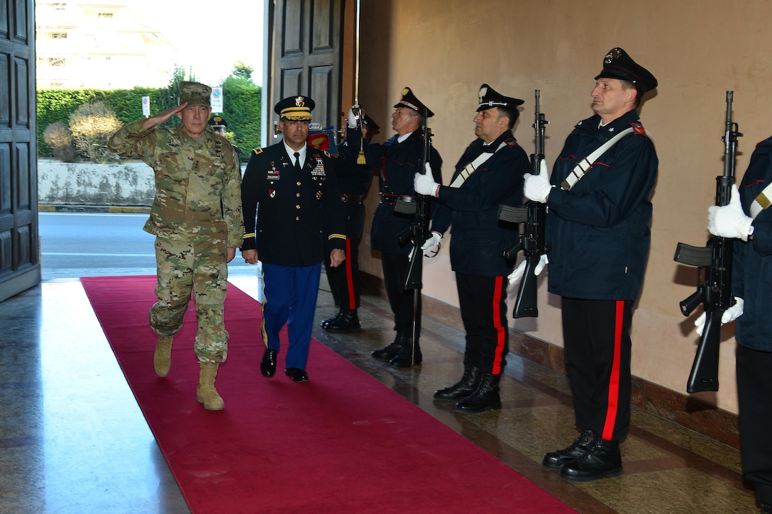 Lt. Gen. Charles D. Luckey (left), Commanding General U.S. Army Reserve Command, U.S. Army Col. Darius S. Gallegos (center), CoESPU deputy director, browse the Italian Carabinieri honor guard during visit at Center of Excellence for Stability Police Units (CoESPU) Vicenza, Italy, January 20, 2017.(U.S. Army Photo by Visual Information Specialist Paolo Bovo/released)