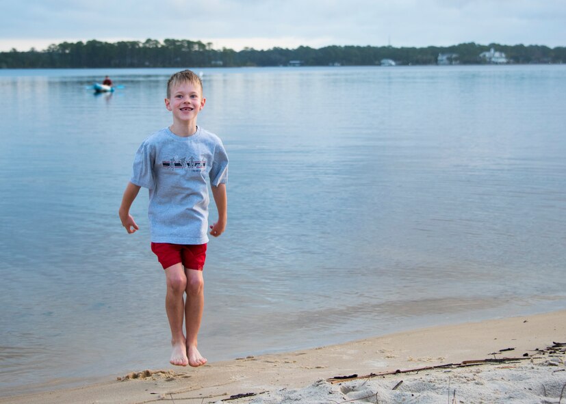 Brendan Cutler, 8 years old, jumps up and down during the start of the 7th annual Polar Bear Plunge Jan. 20 at Post’l Point at Eglin Air Force Base, Fla. Cutler participated in the plunge with his father and his sister. More than 50 people came out for the PBP during a Florida, winter morning with a temperature of 65 degrees. (U.S. Air Force photo/Ilka Cole) 