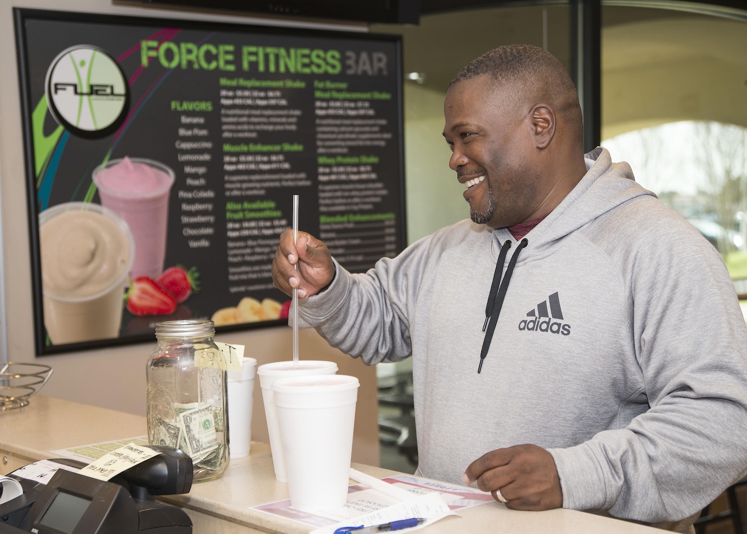 Reginald Creech, Force Fitness Bar customer, receives a protein smoothie following a workout at the Rambler Fitness Center on Joint Base San Antonio-Randolph Jan. 20, 2017. The Recommended Dietary Allowance (RDA), the amount of a nutrient an individual needs to meet basic nutritional requirements, suggests that protein is more effective if consumption is spaced out over the day’s meals and snacks, rather than loading up during any one meal. (U.S. Air Force photo by Airman 1st Class Lauren Parsons/Released)