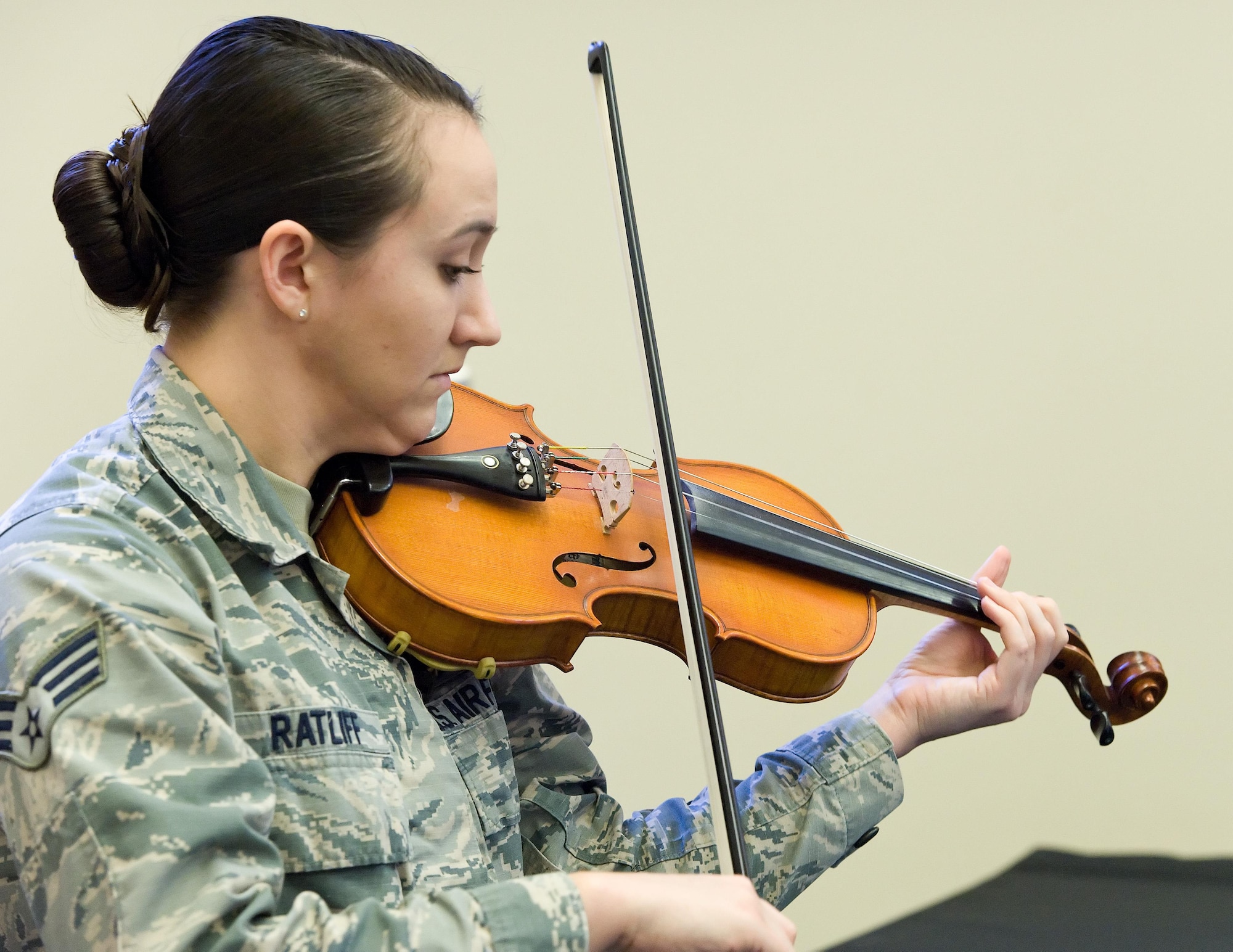 Senior Airman Emily Ratliff, 436th Operations Support Squadron, plays the national anthem on her violin at the beginning of a tribute to Dr. Martin Luther King, Jr., Jan. 19, 2017, at the base chapel on Dover Air Force Base, Del. About 30 Team Dover member attended the tribute hosted by the 436th Airlift Wing Equal Opportunity Office. (U.S. Air Force photo by Roland Balik)