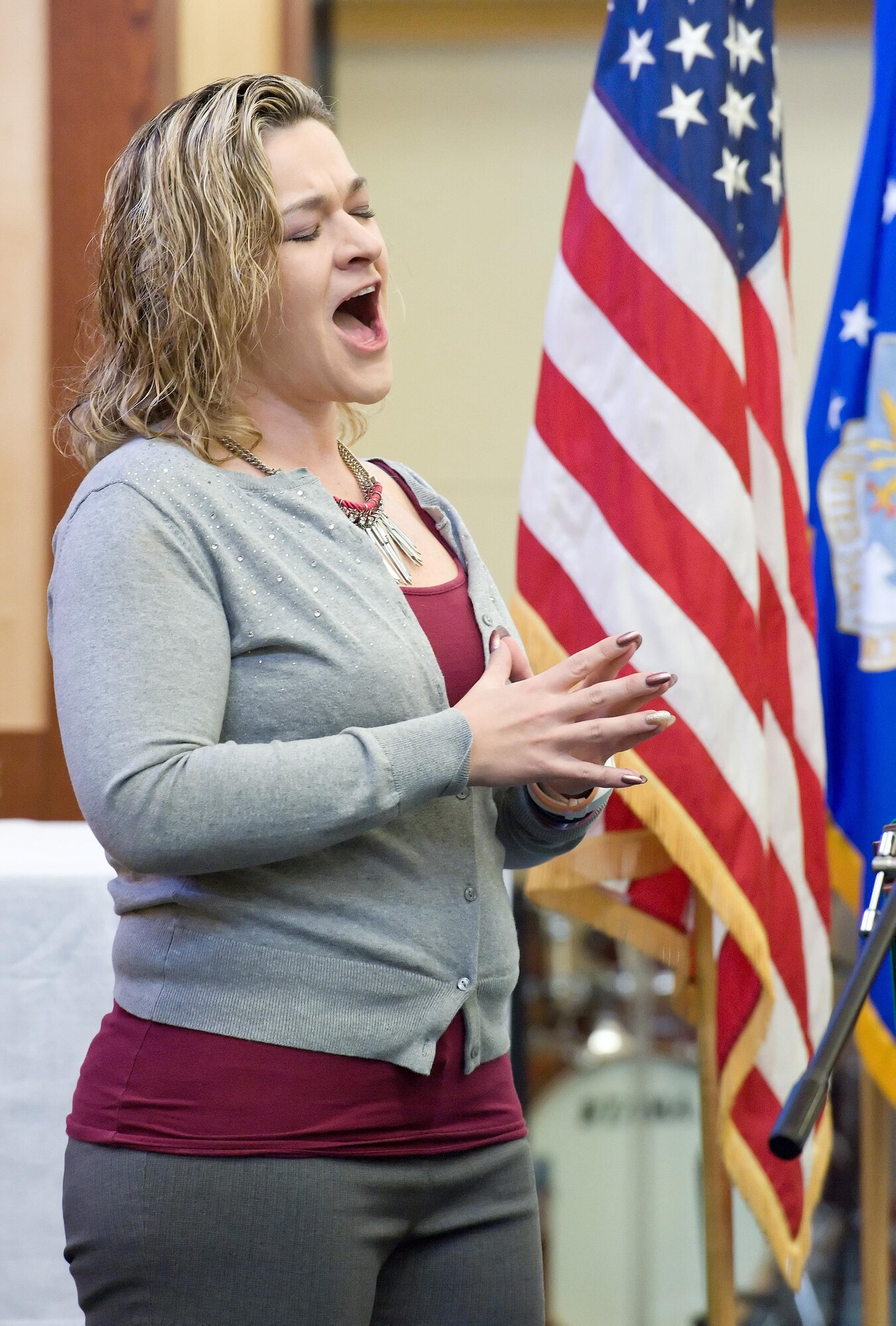 Stephanie Harrison, 3rd Airlift Squadron, sings “The Battle Hymn of the Republic” as part of Team Dover’s tribute to Dr. Martin Luther King, Jr., Jan. 19, 2017, at the base chapel on Dover Air Force Base, Del. Approximately 30 Team Dover members including base senior leadership attended the tribute. (U.S. Air Force photo by Roland Balik)