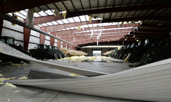 A structure housing military vehicles is severely damaged after a tornado strikes Marine Corps Logistics Base Albany, Jan. 23, 2017. A line of strong thunderstorms produced a tornado that passed through the Albany, Georgia community and Marine Corps Logistics Base Albany carving a path of destruction leaving the landscape strewn with broken trees, downed power lines and damaged structures, Jan. 22, 2017.