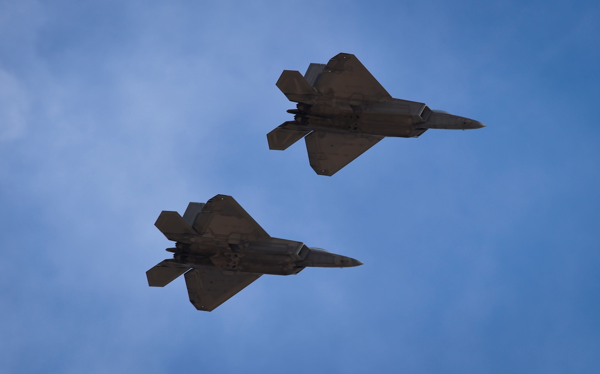 U.S. Air Force F-22 Raptors assigned to the 1st Fighter Wing fly into Nellis Air Force Base, Nev., Feb. 18, 2017. The fifth generation aircraft flew in from Langley Air Force Base, Va., to participate in the three-week Red Flag 17-1. (U.S. Air Force photo by Staff Sgt. Natasha Stannard)