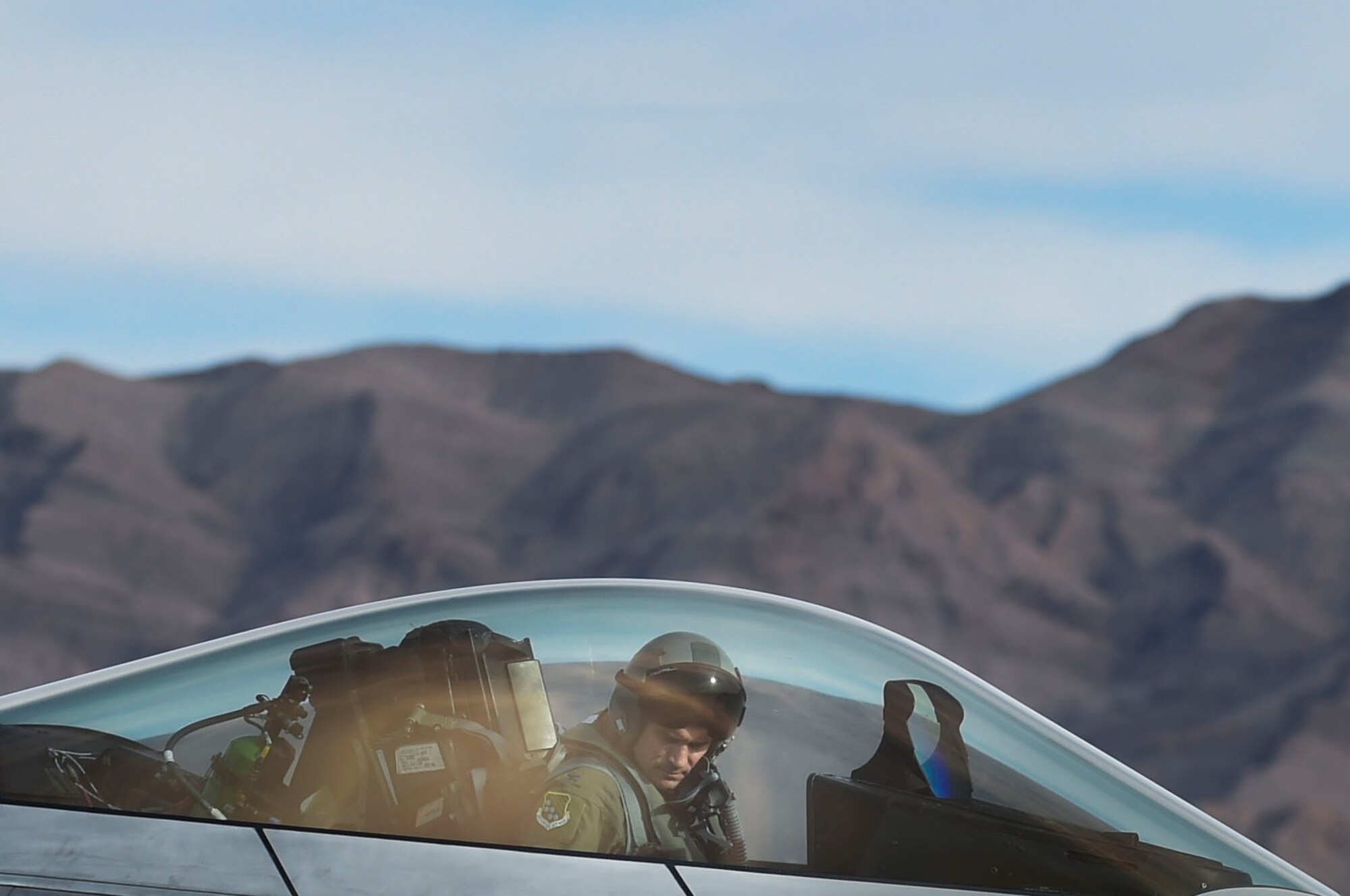 U.S. Air Force Col. Peter Fesler, 1st Fighter Wing commander, arrives to Nellis Air Force Base, Nev., Feb. 18, 2017, to participate in Red Flag 17-1. Red Flag is the U.S. Air Force's premier joint and allied force air-to-air combat training exercise. (U.S. Air Force photo by Staff Sgt. Natasha Stannard)