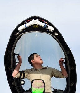 U.S. Air Force Airman 1st Class Joshua Aujero, 27th Aircraft Maintenance Unit crew chief, inspects the canopy of a U.S. Air Force F-22 Raptor after landing to participate in Red Flag 17-1 at Nellis Air Force Base, Nev., Feb. 18, 2017.  Inspecting the canopy is a safety measure conducted post flight to ensure that the lamination is intact. (U.S. Air Force photo by Staff Sgt. Natasha Stannard)