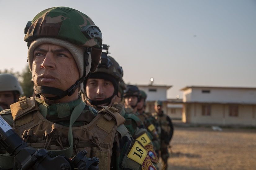 Iraqi forces soldiers wait to begin training at Camp Taji, Iraq, Jan. 22, 2017. The soldiers were learning from coalition personnel how to search personnel and vehicles for improvised explosive devices. Army photo by Spc. Christopher Brecht