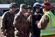 U.S. Airmen assigned to the 20th Civil Engineer Squadron fire department and 20th CES explosive ordnance disposal flight discuss a plan of action before participating in a joint hazardous material training at Shaw Air Force Base, S.C., Jan. 19, 2017. The Airmen handled a scenario where an overturned truck spilled simulated chemicals into the environment, caused casualties, and had a possible explosive device in the vicinity. (U.S. Air Force photo by Airman 1st Class Christopher Maldonado)