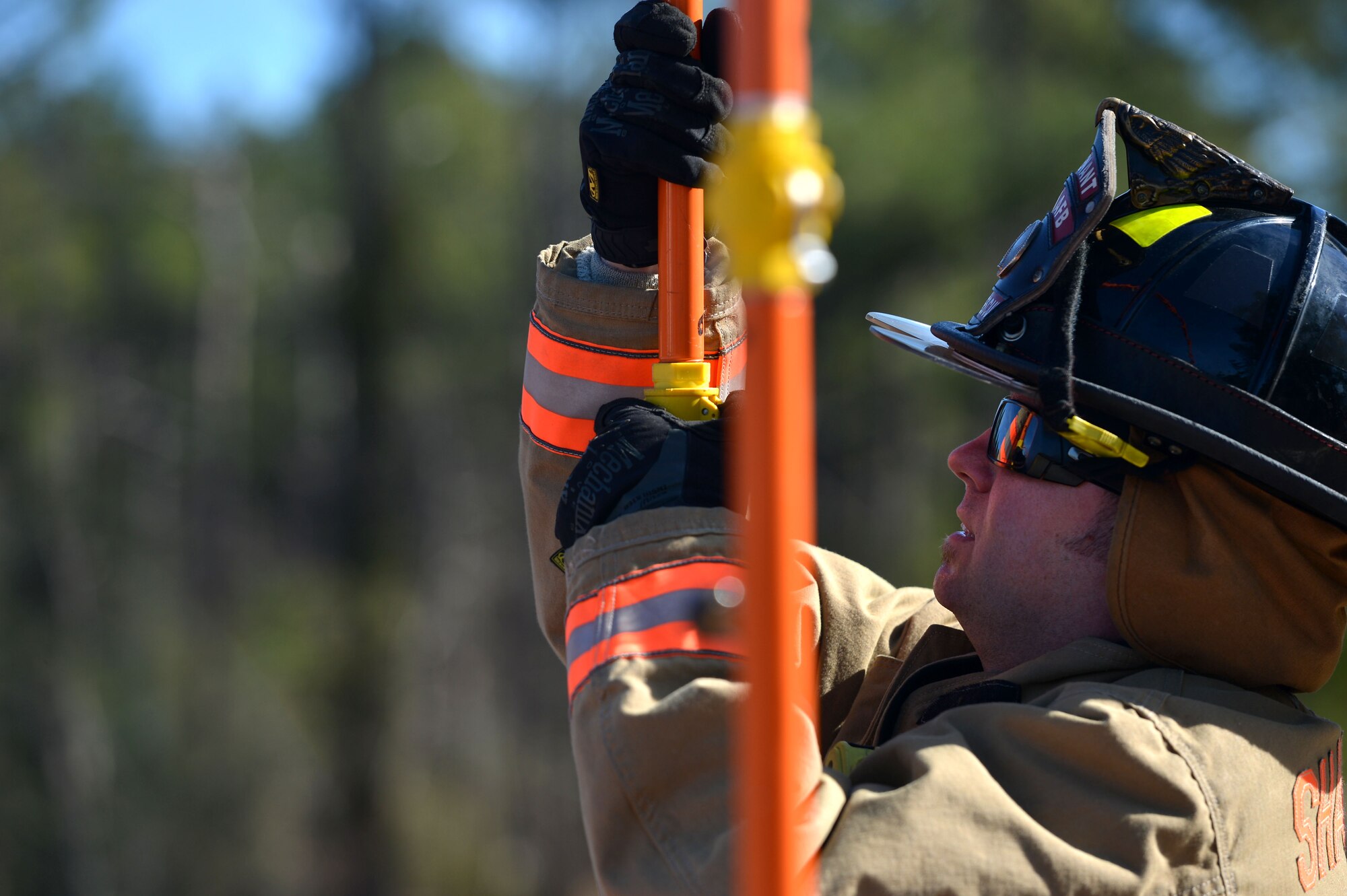 Wayne Brugh, 20th Civil Engineer Squadron fire department driver and operator, assembles a decontamination pool shower pipe during a hazardous material training at Shaw Air Force Base, S.C., Jan. 19, 2017. During the joint exercise, fire fighters were tasked with simulating the decontamination of 20th Aerospace Medicine Squadron bioenvironmental flight Airmen and 20th CES explosive ordnance disposal flight as they exited the simulated chemical spill site. (U.S. Air Force photo by Airman 1st Class Christopher Maldonado)