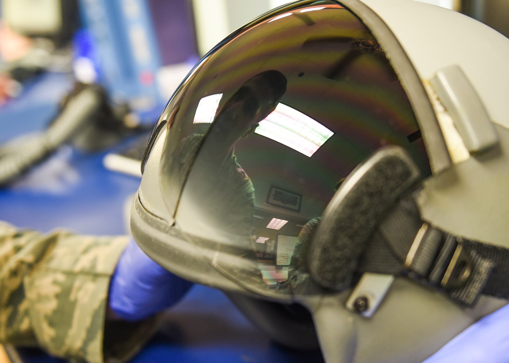 U.S. Air Force Staff Sgt. Ryan Kracher, 325th operations Support Squadron aircrew flight equipment craftsman, inspects a pilot’s helmet at Tyndall Air Force Base, Fla., Jan. 19, 2017. Aircrew flight equipment technicians inspect multiple pieces of equipment necessary for pilot safety during operations. (U.S. Air Force photo by Senior Airman Dustin Mullen/Released)