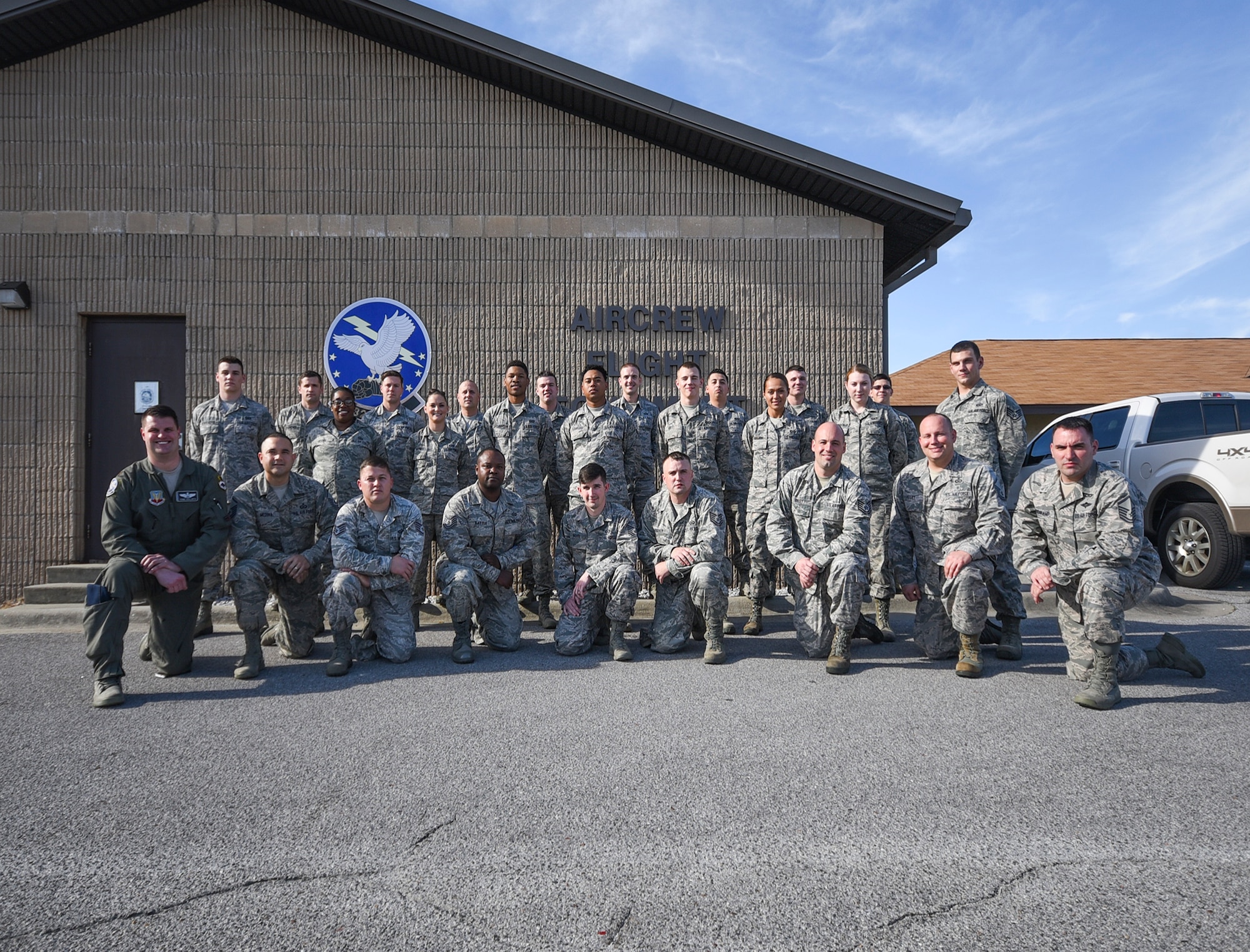 Tyndall Air Force Base’s aircrew flight equipment shop stands  outside their main building Jan. 19, 2017. The flight has been named the 2016 Air Combat Command Outstanding AFE Large Program of the Year. (U.S. Air Force photo by Senior Airman Dustin Mullen/Released)