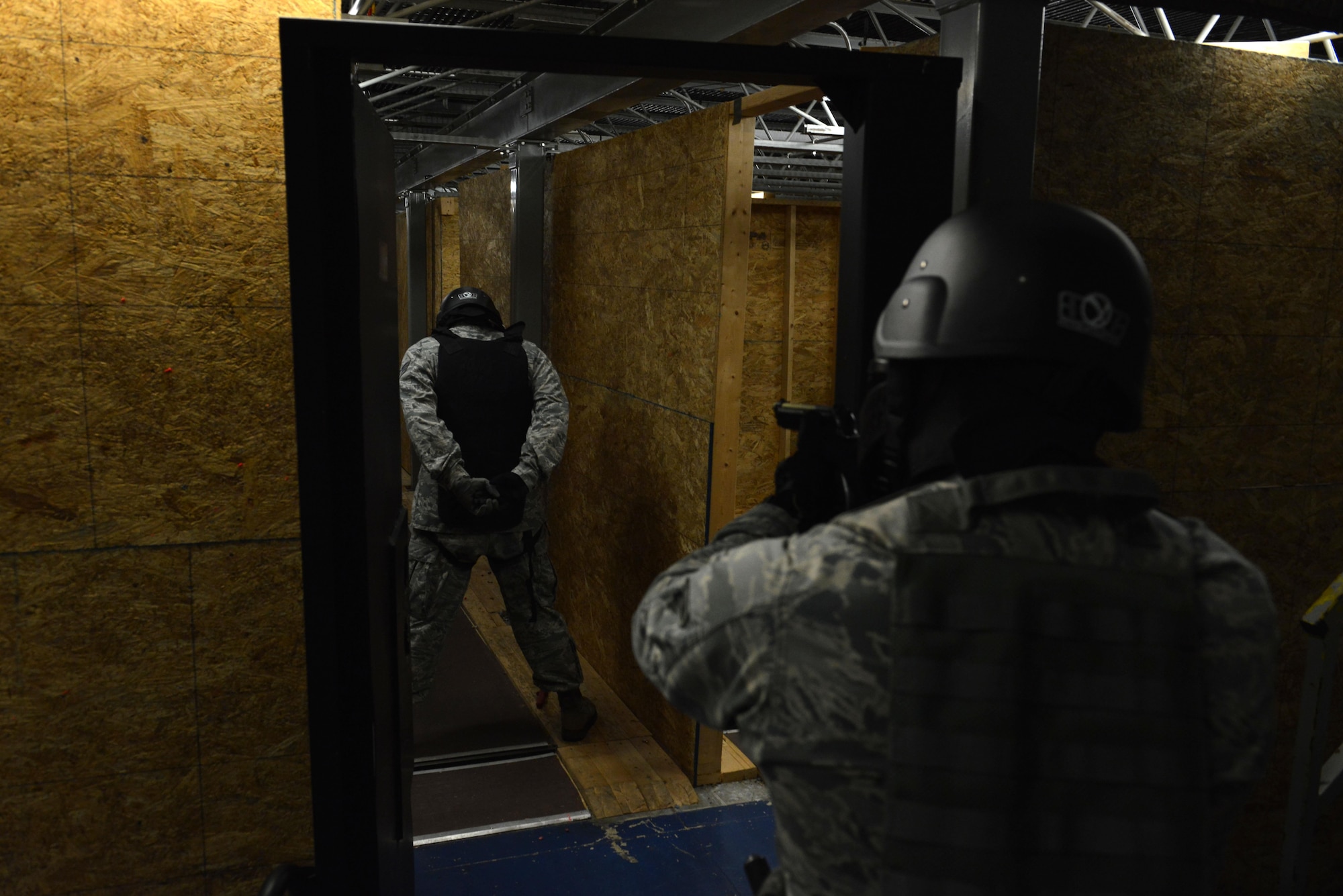 A U.S. Airman gives orders to a simulated attacker at Shaw Air Force Base, S.C., Jan. 18, 2017. After receiving their annual use of force training, 20th Security Forces Squadron Airmen used their training to resolve three different scenarios with varying levels of threat. (U.S. Air Force photo by Airman 1st Class Destinee Sweeney)