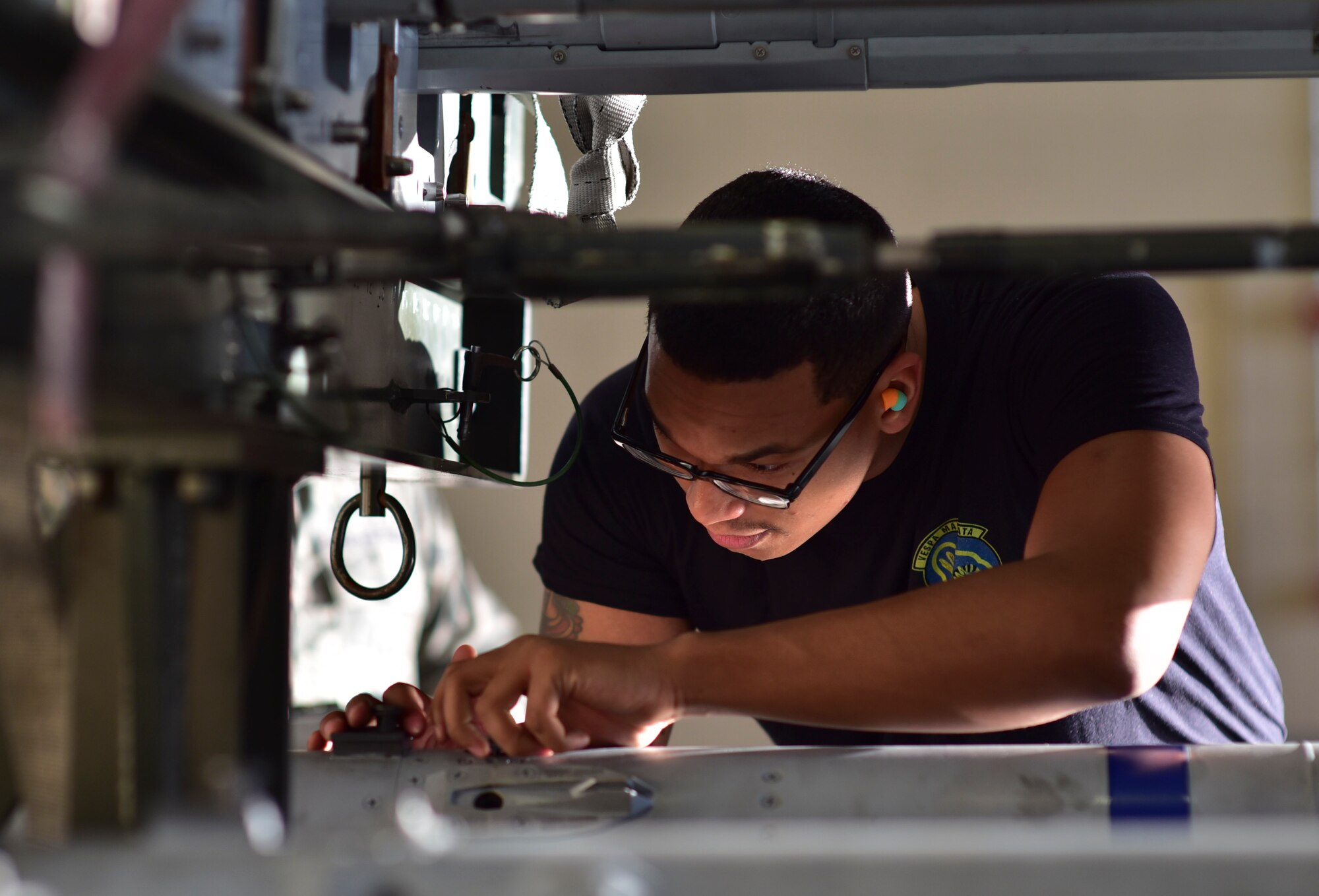 U.S. Air Force Airman 1st Class Elijah Cruz, 43rd Aircraft Maintenance Unit armament systems technician, inspects a training missile for damage during the Load Crew of the Year competition at Tyndall Air Force Base, Fla., Jan. 20, 2017. Airmen from the 43rd AMU and 95th AMU were evaluated on their ability to load multiple weapon systems in a timely, safe and reliable manner under 90 minutes. (U.S. Air Force photo by Tech. Sgt. Javier Cruz/ Released)