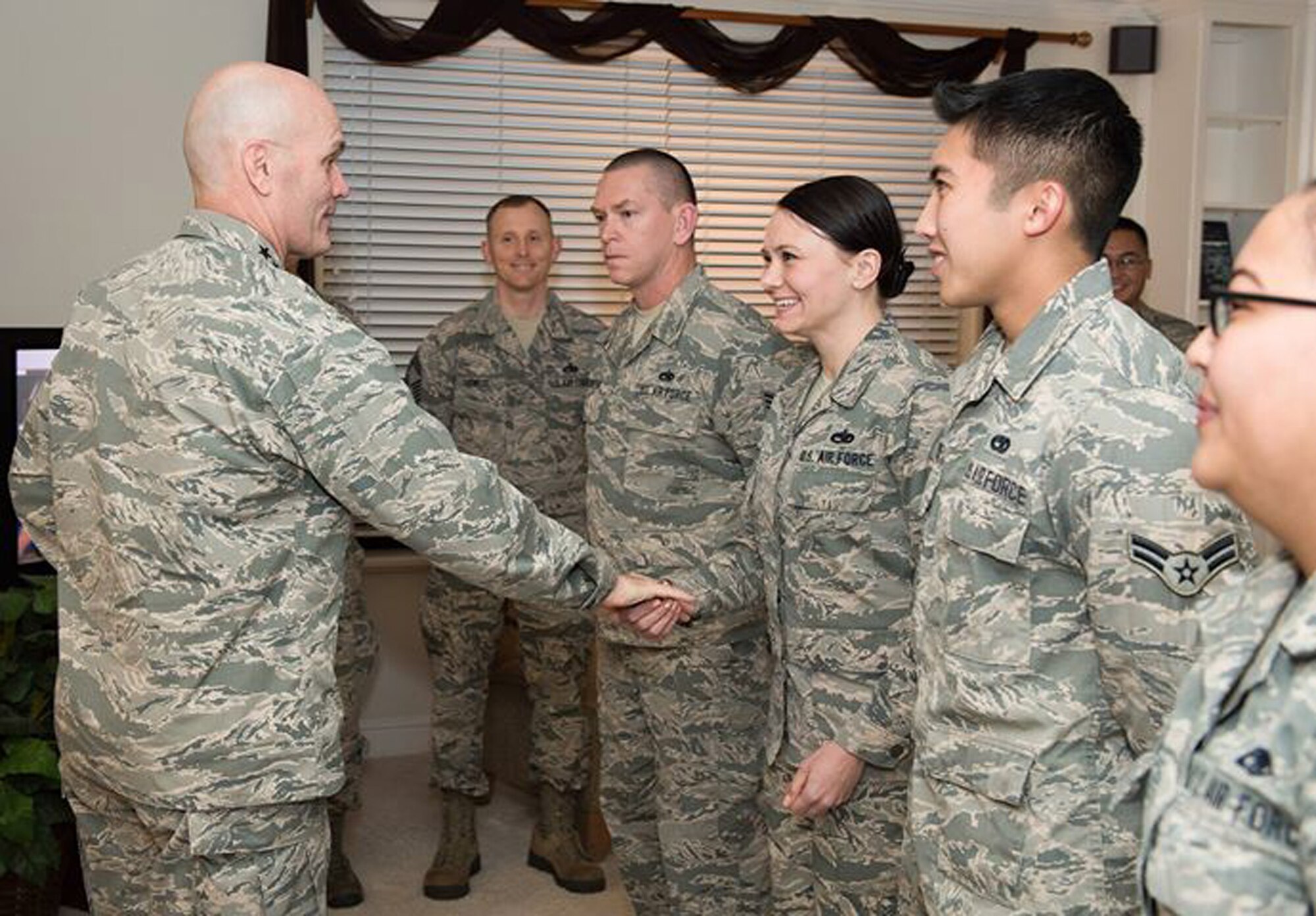 Gen. Carlton D. Everhart II, Air Mobility Command commander, recognizes Master Sgt. Samantha Everett, 749th Aircraft Maintenance Squadron electro-environmental technician, during a visit to Travis Air Force Base, Calif., Jan. 17, 2017. (U.S. Air Force photo/Heide Couch)