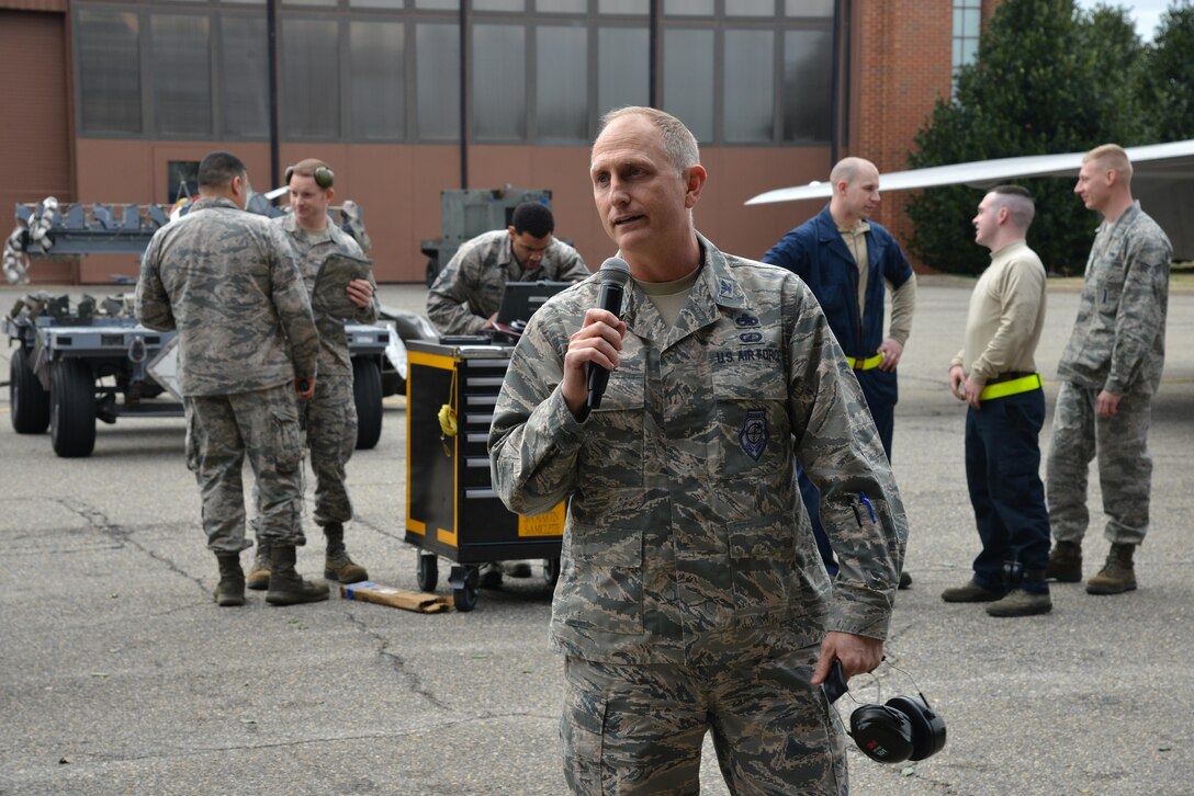 U.S. Air Force Col. Todd Andre, 1st Maintenance Group commander, speaks to the crowd after the 1st Maintenance Squadron Weapons Load Crew of the Year competition at Joint Base Langley-Eustis, Va., Jan. 13, 2017. Maintainers assigned to the 1st Maintenance Group are responsible for world-wide rapid deployment and the employment of combat-ready F-22 Raptors. (U.S. Air Force photo by Airman 1st Class Tristan Biese)