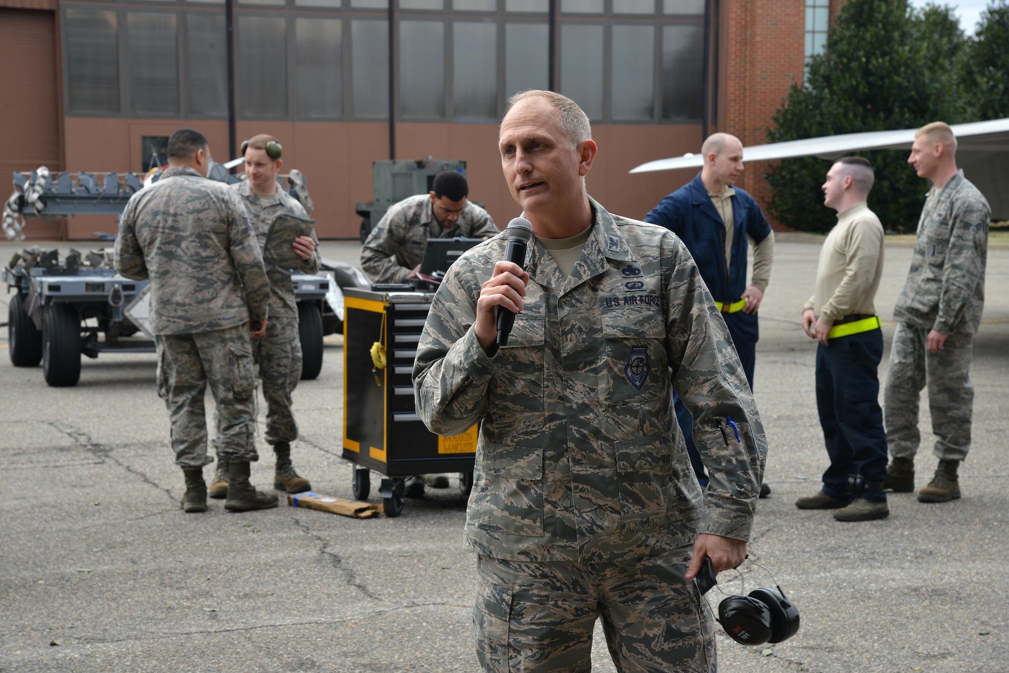 U.S. Air Force Col. Todd Andre, 1st Maintenance Group commander, speaks to the crowd after the 1st Maintenance Squadron Weapons Load Crew of the Year competition at Joint Base Langley-Eustis, Va., Jan. 13, 2017. Maintainers assigned to the 1st Maintenance Group are responsible for world-wide rapid deployment and the employment of combat-ready F-22 Raptors. (U.S. Air Force photo by Airman 1st Class Tristan Biese)