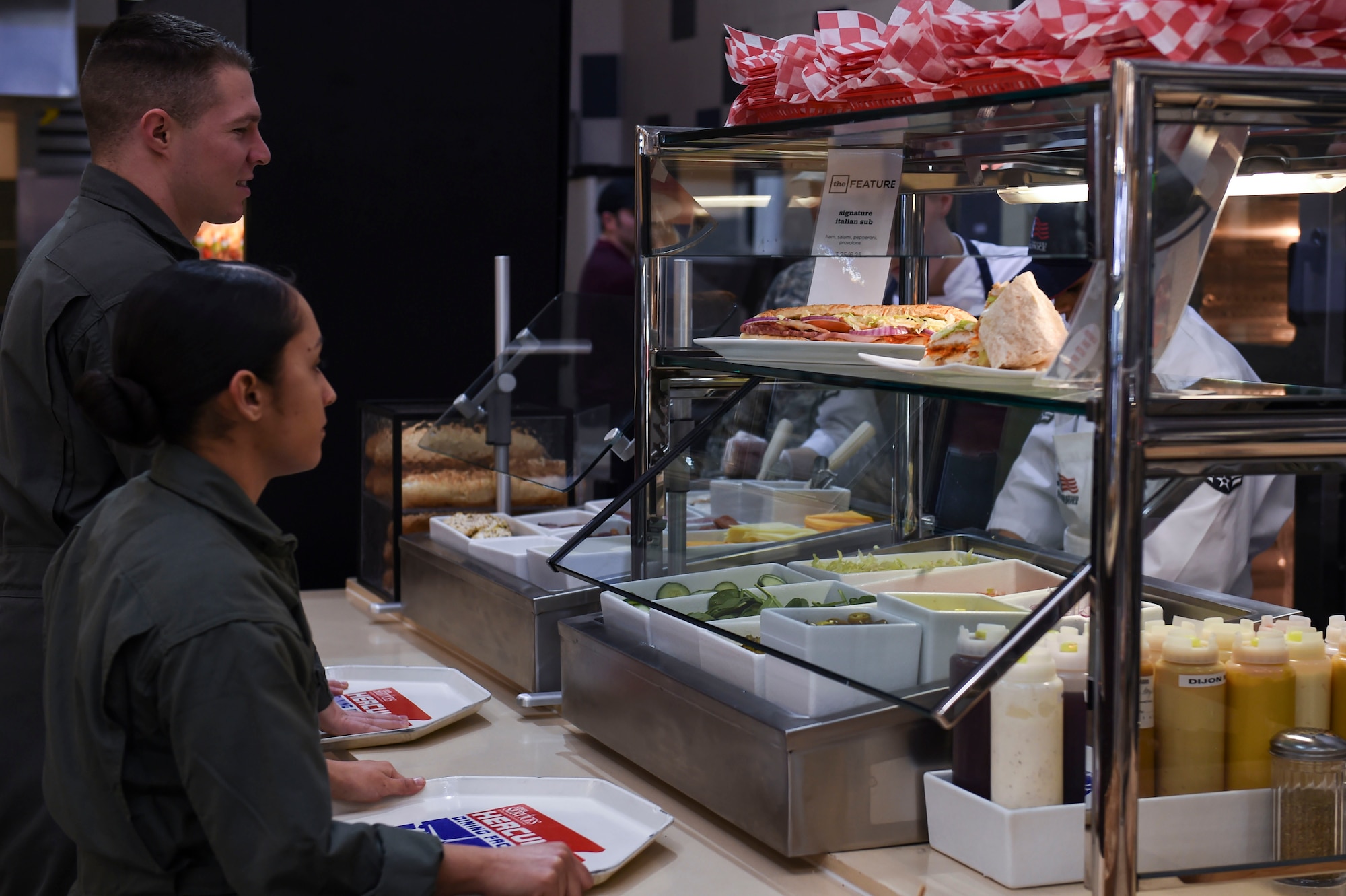 U.S. Marine Corps students order a sandwich at the upgraded deli section Jan. 23, 2017, at Little Rock Air Force Base, Ark. Members can fill out an order card to build the sandwich of their choice. (U.S. Air Force photo by Staff Sgt. Kaylee Clark) 