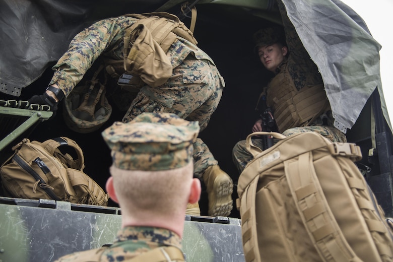 Marines load up for transportation during a Strategic Mobility Exercise aboard Marine Corps Air Station Cherry Point, N.C., Jan. 20, 2017. Marines assigned to Marine Air Support Squadron 1, Marine Air Control Group 28, 2nd Marine Aircraft Wing simulated troop movement in response to a limited/ no-notice mock deployment of a Direct Support Center with extensions in support of overseas contingency operations. MASS-1 is responsible for the planning, receiving, coordination and processing of requests for direct or close air support. It provides this through the DASC, whether ground or airborne based.  (U.S. Marine Corps photo by Sgt. N.W. Huertas/ Released) 